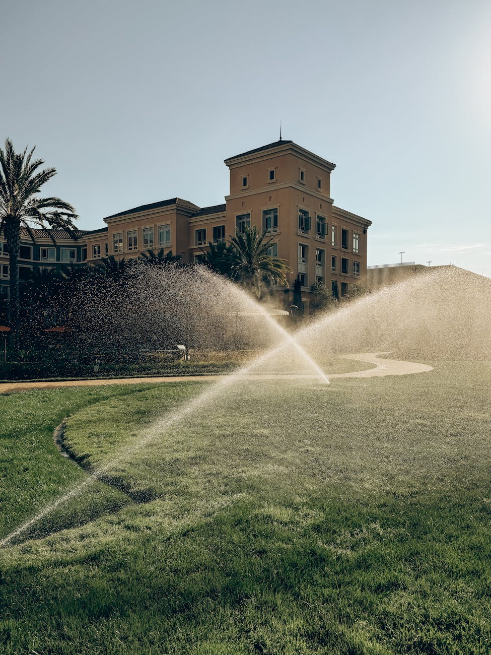 sprinklers watering lawn at palace